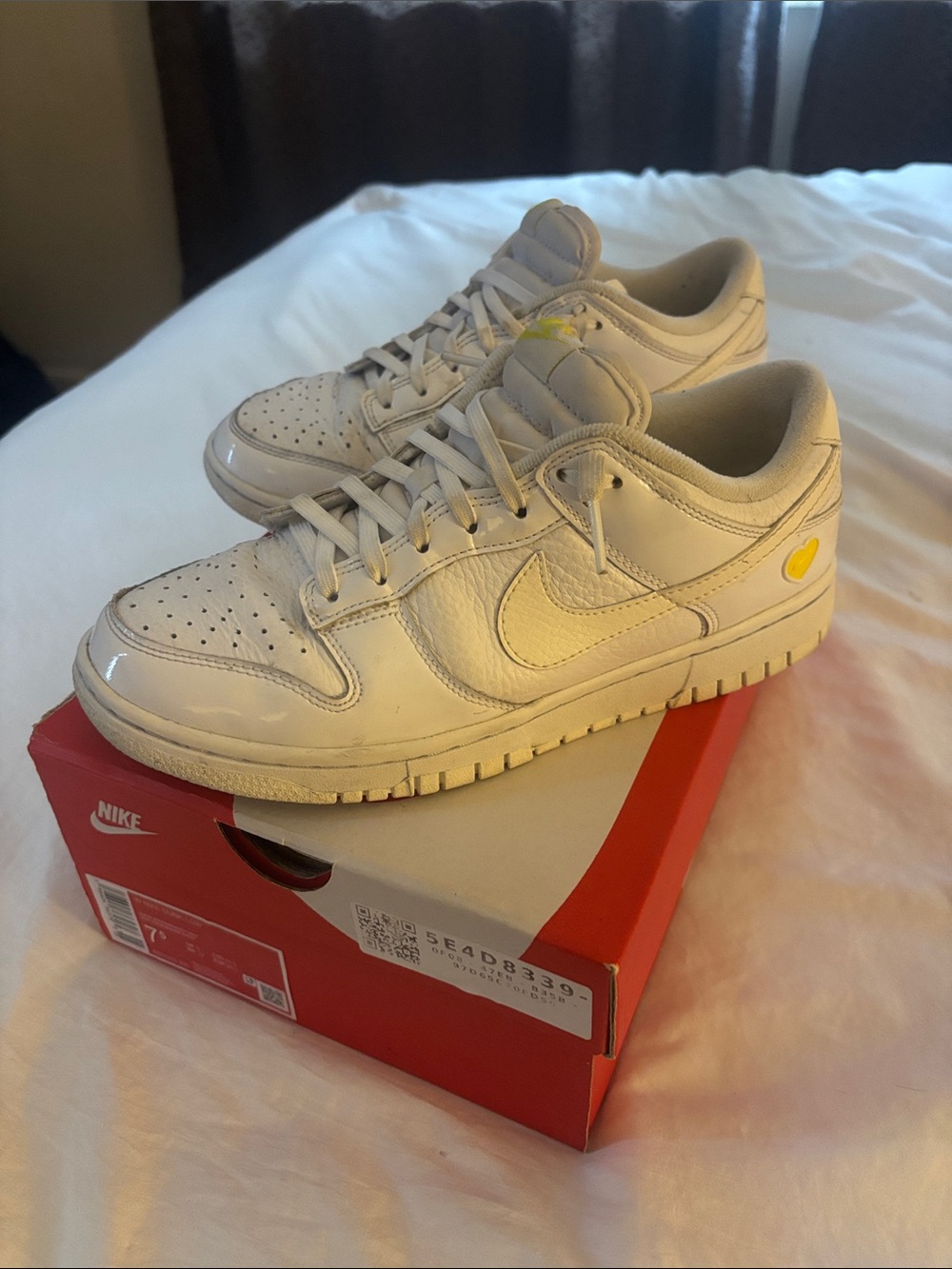 Nike White Low-Top Sneakers with Yellow Heart Detail